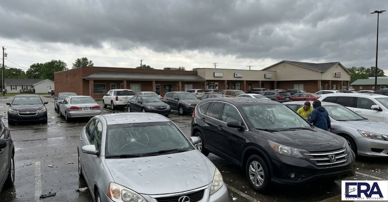 Hail damaged cars in Owensboro Kentucky parking lot showing why auto insurance rates are rising