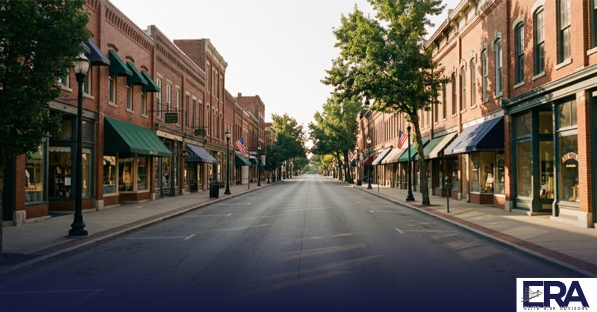 Street-level view of downtown Owensboro Kentucky small business district with brick storefronts in warm afternoon light — business insurance for local entrepreneurs