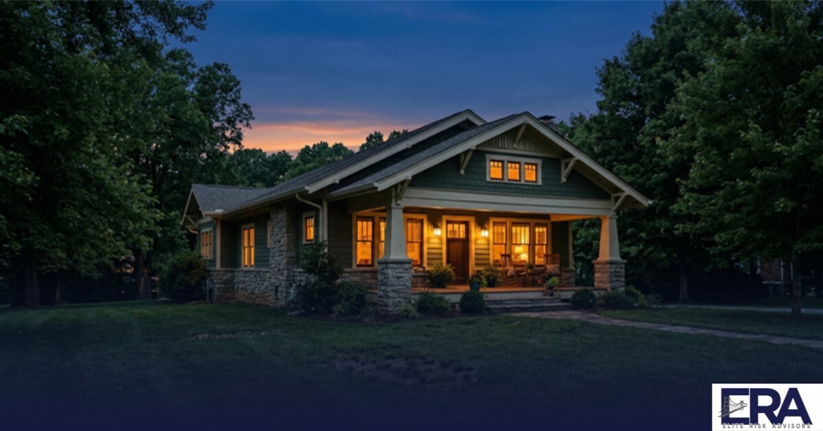 Kentucky craftsman home at twilight with warm interior light glowing through windows — complete home insurance guide for Owensboro residents