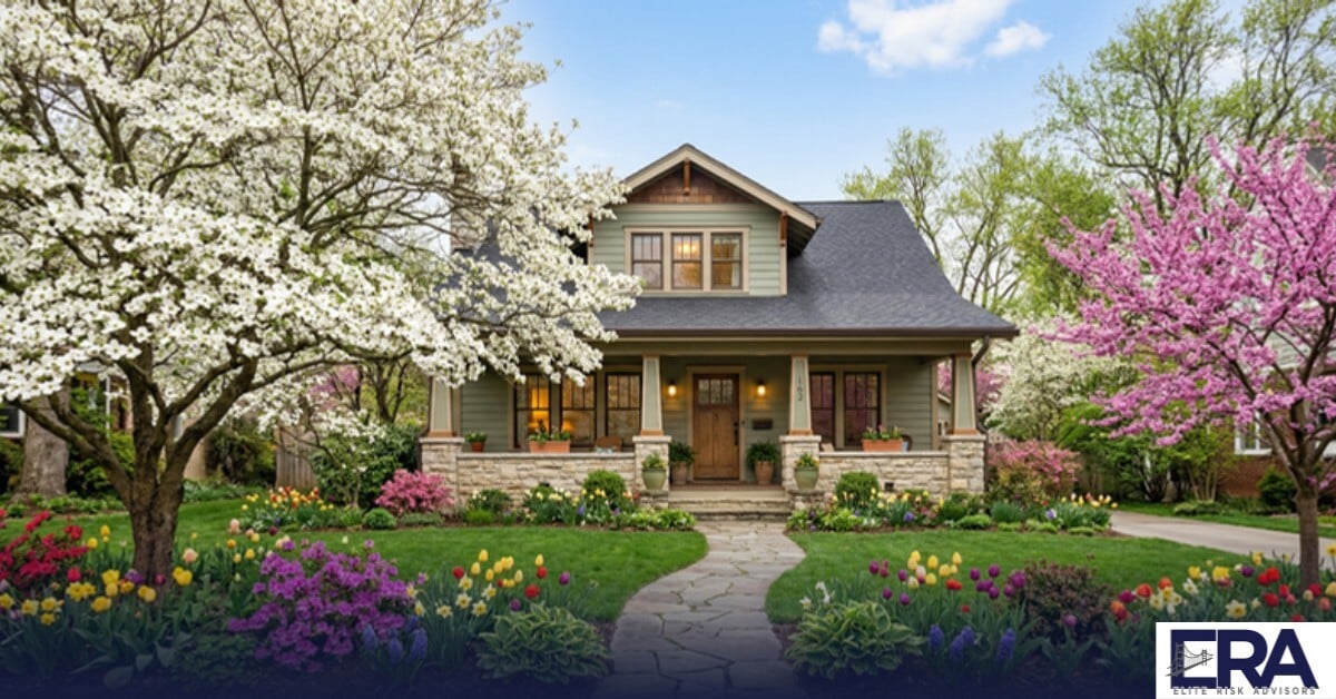 Craftsman home surrounded by spring flowering trees and fresh green lawn in Owensboro Kentucky — spring insurance checklist for Kentucky homeowners